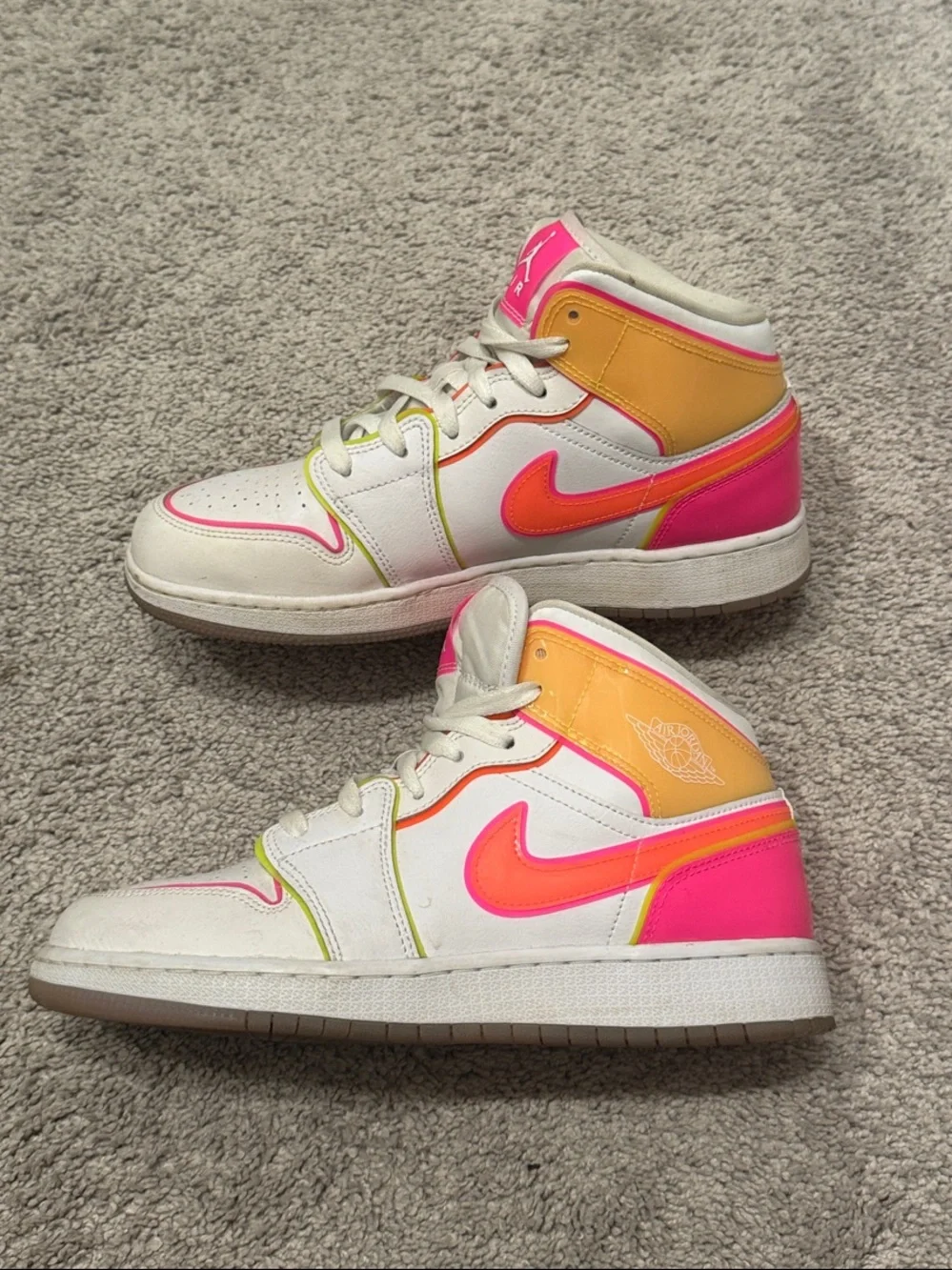 Kids Jordan White High-Top Sneakers with Neon Pink and Orange Accents